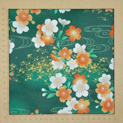 Green Japanese fabric with white, ornage and gold cherry blossom patterns