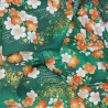 Green Japanese fabric with white, ornage and gold cherry blossom patterns
