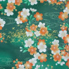 Green Japanese fabric with white, ornage and gold cherry blossom patterns