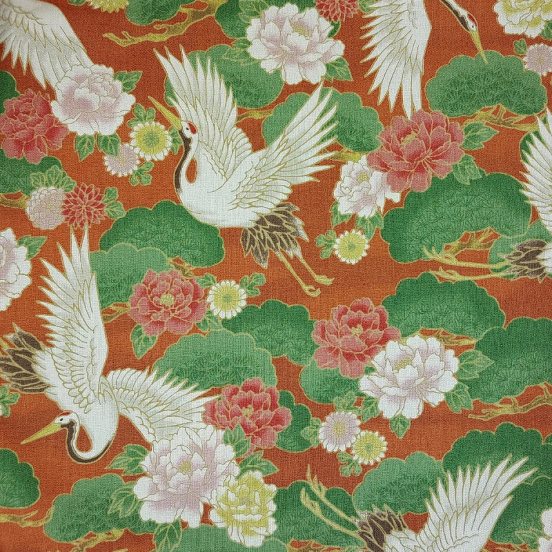 Japanese fabric with cranes and peonies on a rusty color background