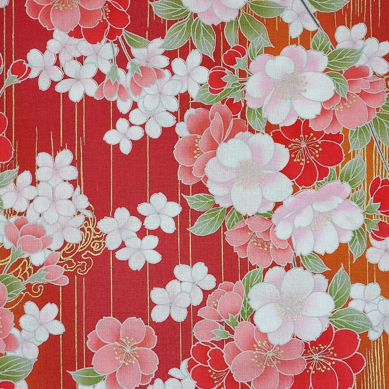Red Japanese fabric with pink, white and gold cherry blossom patterns