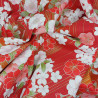 Red Japanese fabric with pink, white and gold cherry blossom patterns