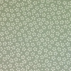 Spring green fabric with small cherry blossom patterns