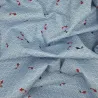 Light blue textured fabric with carps and waves patterns